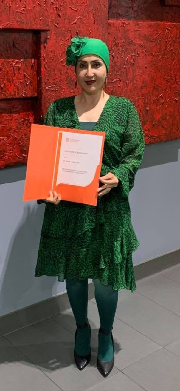 Abeer Alsadoon holding a Charles Sturt University certificate